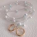 Close-up of pastel macaron beads and white pearls with golden spring ring clasps - 90cm / Crystal Mermaid Bead [Gold Buckle]