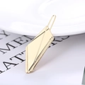 Close-up of a polished gold geometric metal hair clip with refined textured patterns - Gold - Rhombus