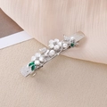 Dettaglio del fermaglio per capelli in argento con fiori di conchiglia, perle e foglie - Argento