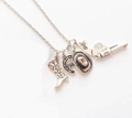 Collana da cowboy con ciondoli a forma di stivale, ferro di cavallo, cappello e pistola - Argento