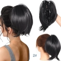 Detail view of black claw clip ponytail extension with internal clip and model styling - Natural Black-2