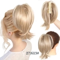 Detail of light blonde wavy ponytail extension with claw clip attachment style 27/613 - Camel-27/613