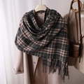 Close-up of black and grey plaid scarf featuring soft cashmere feel and fringe detail - Black Grey & Beige Plaid