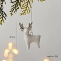White ceramic reindeer ornament with silver cord hanging on festive pine branch - Christmas Elk G