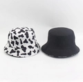 Detail shot of the black and white cow print and solid black cotton bucket hat texture - M(56-58cm) / Double-sided Cow Pattern Black