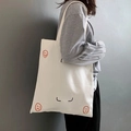 Detail shot of white canvas tote bag with Call Me Mr. Normal print design on grey background - Mr. Normal