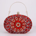 Detail of red rhinestone evening bag with floral crystal pattern and gold metal handle - Red