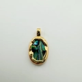 Detailed macro view of oval abalone shell pendant with 18K gold-plated frame - Oval Abalone Shell / Gold