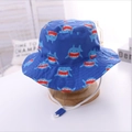 Blue kids bucket hat with shark print and adjustable white chin strap for outdoor sun protection - 20 Blue Sharks / 54cm