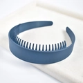 Detail view of a dark blue non-slip wide headband with inner teeth on a beige velvet tray - 4# Wide Lacquered Blue Toothed Headband