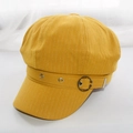 Close-up of mustard yellow newsboy cap fabric with white stripes and metal ring detail - Adult 55-58cm / Yellow