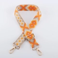 Detailed view of the orange and beige geometric woven strap with golden metal lobster clasps - Ethnic Jacquard 6 - Light Gold Buckle