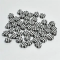 Detailed view of 10mm checkered heart clay beads for DIY handmade jewelry crafts - Black