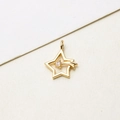 Detailed view of a gold star-shaped pendant with a sparkling zircon inlay for jewelry DIY - Shooting Five-pointed Star
