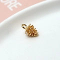 Detailed macro view of a gold pine cone pendant with scales for DIY jewelry making - 10# Pinecone 3