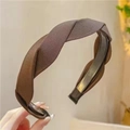 Detail of a brown twisted fabric headband with an elegant textured woven finish - Dark Coffee