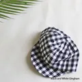 Close-up of black and white plaid baby baseball cap with soft brim in cotton fabric - Black