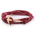Macro shot of gold anchor clasp with Vikings engraving and tricolor nylon rope cord - GA-09 Red Blue White Mixed Rope With Gold Anchor