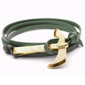 Detail view of a green leather wrap bracelet featuring a polished gold anchor clasp - Green