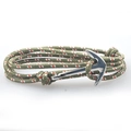 Detailed view of nautical woven bracelet featuring a silver anchor clasp and tricolor cord - Red White Green Striped