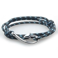 Navy style braided bracelet with silver fish hook anchor clasp on white background - Black Blue
