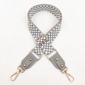 Macro detail of adjustable woven checkered bag strap with grey leather and gold hooks - Gray