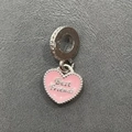 Macro shot of pink enamel heart pendant with Best Friends engraving for DIY bracelets - Best Friends Pink Heart Charm