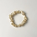 Champagne gold satin silk scrunchie with glossy texture and elastic hair tie design - Small Off-white