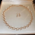 Detail of vintage gold leaf necklace and earrings set with pearls and rhinestones - Leaf Shape Faux Pearl / Gold