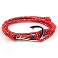 Detail of red nautical braided rope bracelet with blue-white spots and silver fish hook clasp - Red Polka Dot