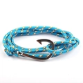 Macro shot of blue nautical braided rope bracelet with a silver fish hook clasp - Blue