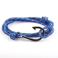 Macro detail of nautical rope bracelet with silver fish hook clasp in red white and blue - Blue Pattern
