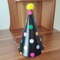 Mini birthday party hat with colorful polka dots on black background and yellow pom-pom - Black Polka Dot Pom-pom Hat