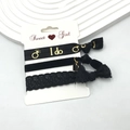 Close-up of black elastic hair band set with gold I do print, heart charm and lace detail - Black Series - I do (4)