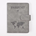 Macro detail of grey PU leather passport holder with world map design and buckle closure - Gray
