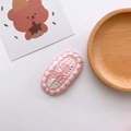 Pink and white handmade crochet hair clip with soft knit texture on a wooden tray - 18-Pink Bowknot