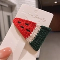 Handmade crochet watermelon hair clip with red and green yarn on display card - Watermelon Pink