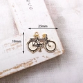 Vintage black and gold bicycle alloy charm with size labels of 25mm by 18mm - Bicycle