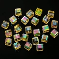 Macro shot of 4-8mm amber cube crystal beads with aurora AB coating on black background - Straight Hole / 4mm (100pcs/Pack) / Bright Gold