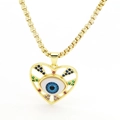 Detalle de colgante de corazón ojo turco con circonitas de colores y cadena oro - Azul