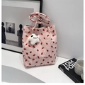 Detailed texture of pink corduroy tote bag with strawberry print and star panda charm - Pink with Pendant