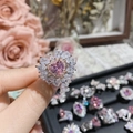 Close-up of pink heart-shaped crystal ring with teardrop stones on hand - Style 0167-Pink Heart With Cluster Stones