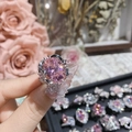Close-up of pink oval cut crystal ring with silver bow setting on hand - Style 0331-Large Oval Pink Gemstone