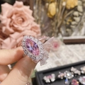 Close-up of pink marquise-cut crystal ring on finger with elegant floral background - Style 0374-Large Pink Marquise Gemstone