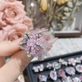 Close-up of pink oval gemstone ring with blue and yellow accents on silver base - Style 0420-Star Shaped Tricolor Gemstone