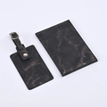 Close-up of marble texture PU leather passport holder and luggage tag travel set - Black