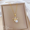 Close-up of golden butterfly pearl necklace with crystal pendant in jewelry box - Titanium Steel Chain Copper Pendant / Butterfly Pearl Necklace (B527)