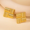 Macro shot of gold square stud earrings with unique 3D wavy texture and metallic finish - Textured Square Stud Earrings