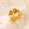 Detailed view of golden butterfly ring with engraved wing patterns and adjustable band - Butterfly Row - Gold