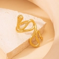 Macro shot of gold snake ring featuring detailed scale texture and sculptural design - 3D Snake Shape - Gold